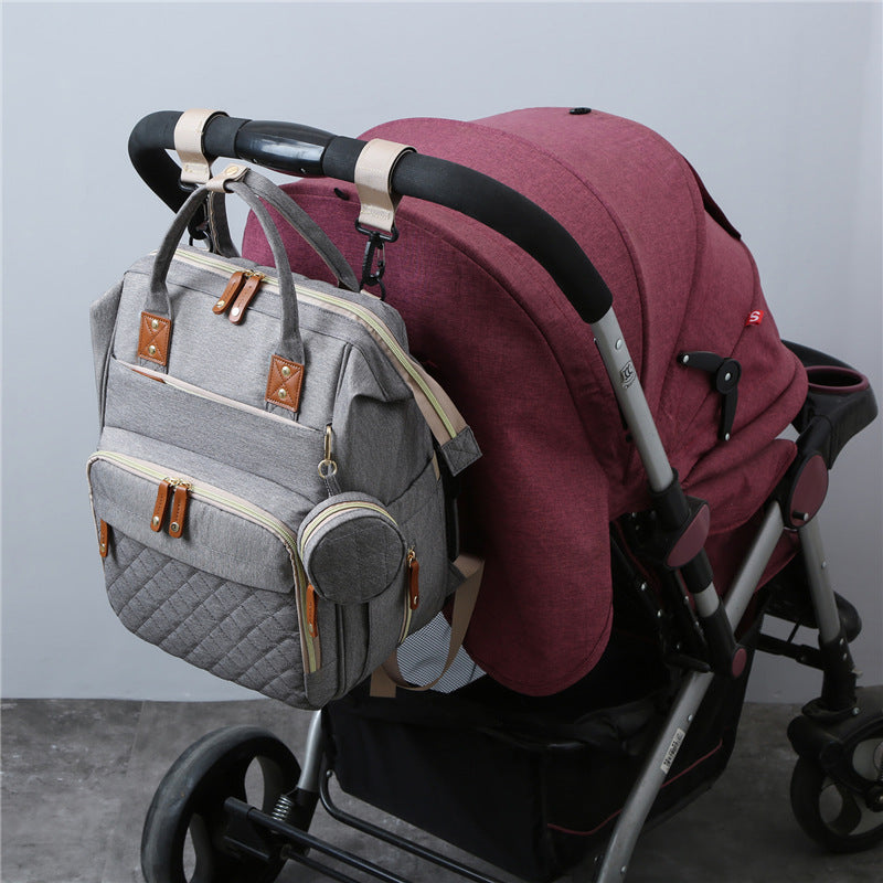 Neuer Mama-Rucksack, der am Kinderwagen befestigt werden kann, Babytasche, faltbare Babybetttasche