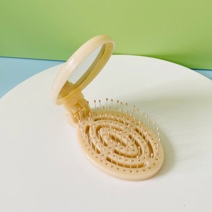 Tragbarer, faltbarer Massagekamm mit Luftkissen für den Haushalt