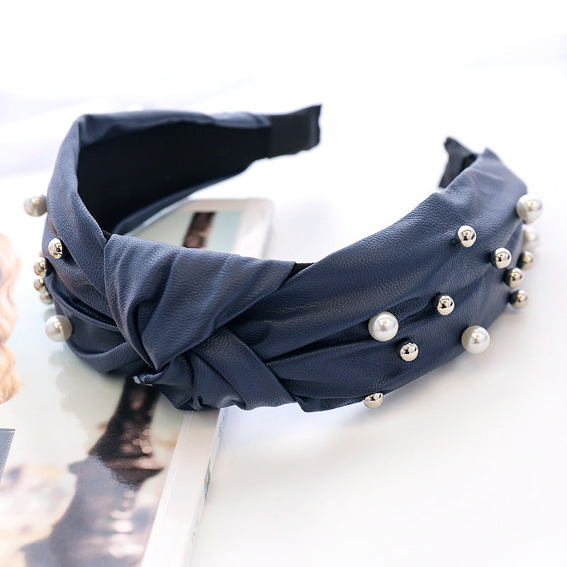 Modisches Haarband aus Leder und Perlen