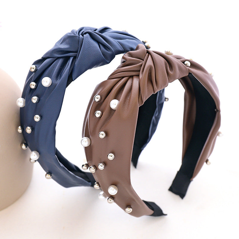 Modisches Haarband aus Leder und Perlen